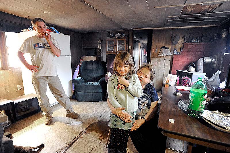 This Friday, March 16 photo shows Robert Chapman, his sister Wendy Turner and her granddaughter, 6-year-old Jadelynn Lee, who were among six people tied up during a home invasion in Steep Falls early Friday morning.