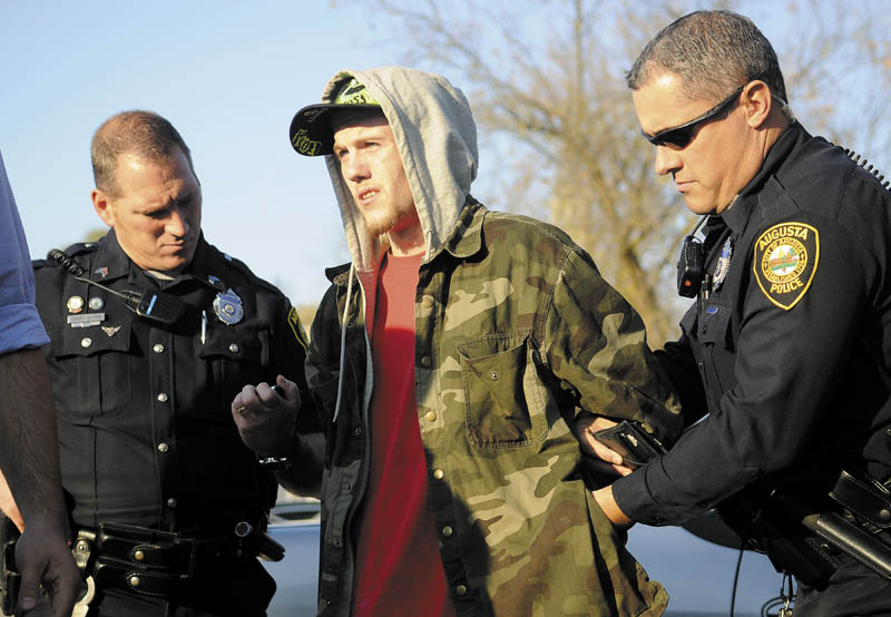 Jake Pilsbury, center, was sentenced Tuesday to 18 months in prison