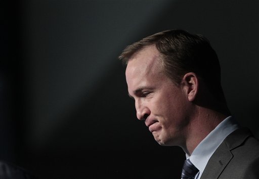 Quarterback Peyton Manning collects his thoughts as he speaks during a news conference in Indianapolis on Wednesday.