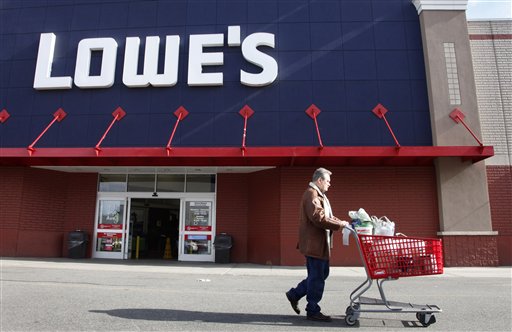 A customer exits a Lowe's store in New York.