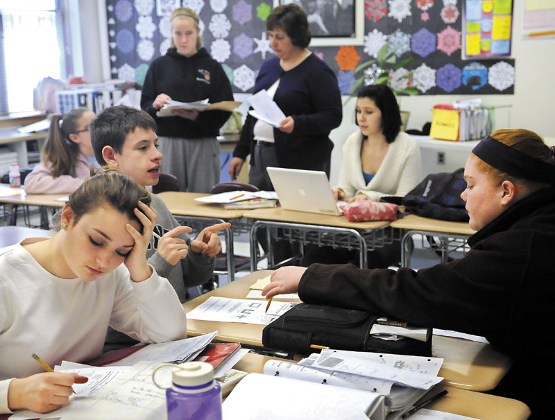 CLASSROOM WORK: Hall-Dale High School students work on a geometry lesson recently in Kendra Guiou’s classroom in Farmingdale. The district, RSU 3, has adopted proficiency-based education, a model that all Maine public schools may need to enact in the next decade.