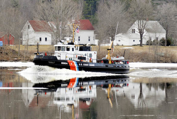 In this 2012 file photo, a Coast Guard ice cutter cruises up the Kennebec River past the Moulton Farm in Pittston. 