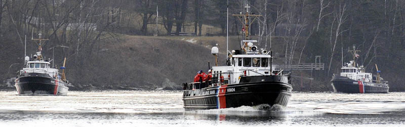 Three Coast Guard ice cutters cruise Tuesday up the Kennebec River between Randolph and Gardiner.