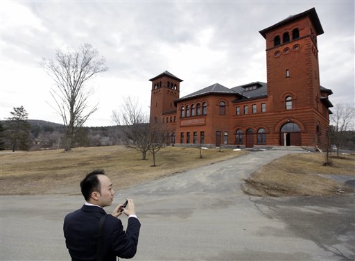 Christopher Chou, chief of staff at the World Evangelical Alliance, shoots a picture of the auditorium on an historic 217-acre campus in Northfield, Mass., last week. The campus, along with its 43 buildings, is being offered for free to an orthodox Christian group who can come up a solid plan to use it.