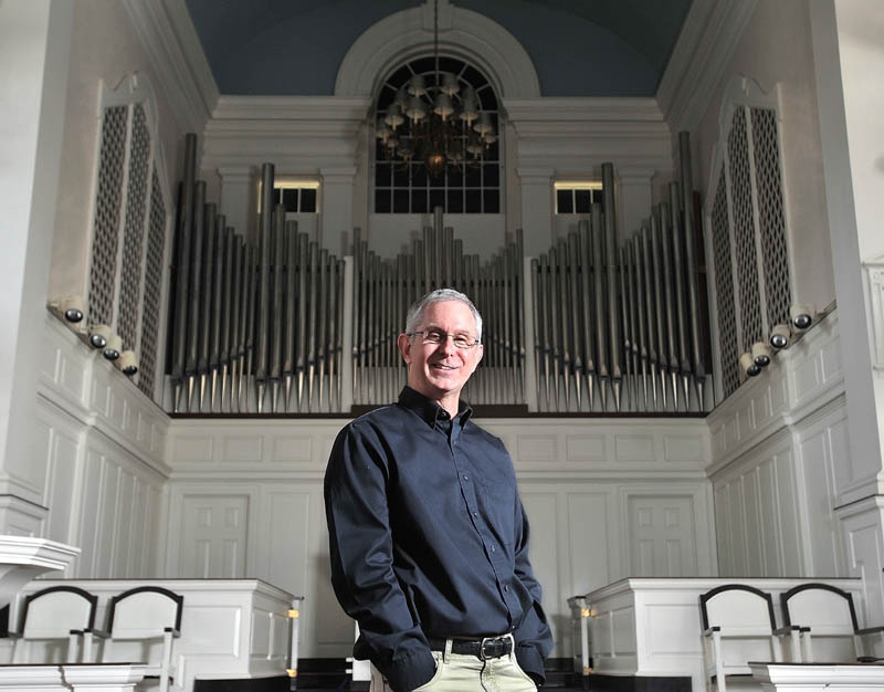 LAST CONCERT: Colby College Symphony Orchestra Director Jonathan Hallstrom, who plans to resign after 28 years and 100 concerts, poses for a portrait at Lorimer Chapel at the college in Waterville last week.
