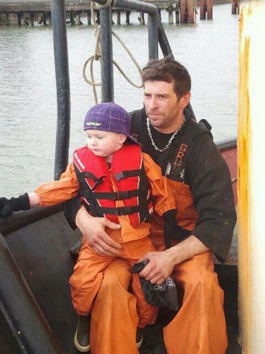 This 2011 photo provided by Adam Bjaranson shows Jason Bjaranson with his son. Jason Bjaranson practiced the life-or-death task of getting into his survival suit so he could do it in 13 seconds, but that didn't make a difference when the Lady Cecelia went down sometime on Saturday.