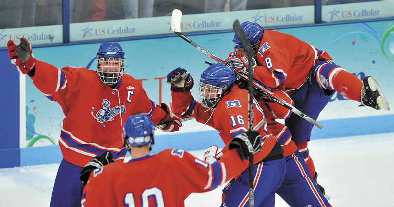 ON THEIR WAY: Messalonskee players celebrate a third-period goal during the Eastern Maine Class B regional championship game Tuesday night at Alfond Arena at the University of Maine in Orono. Messalonskee scored three goals during the second period to win 5-2, advancing to Saturday’s state championship game.