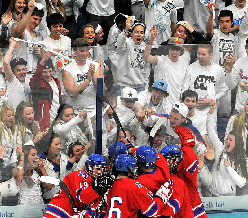 REASON TO CELEBRATE: The Messalonskee boys hockey team celebrates in front of their fans during the Eastern Maine Class B regional championship game Tuesday in Orono. The Eagles take on Greely for the state title at 1 p.m. today in Lewiston.