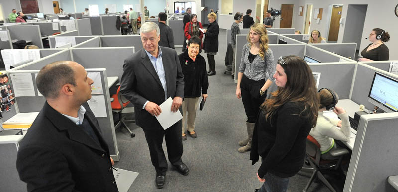 CALL CENTER: U.S. Rep. Mike Michaud, D-2nd District, left center, and Argo Marketing Group CEO Jason Levesque, left, tour the Argo call center in Pittsfield on Friday. The two men faced each other in the 2010 congressional election, won by Michaud with about 55 percent of the vote.