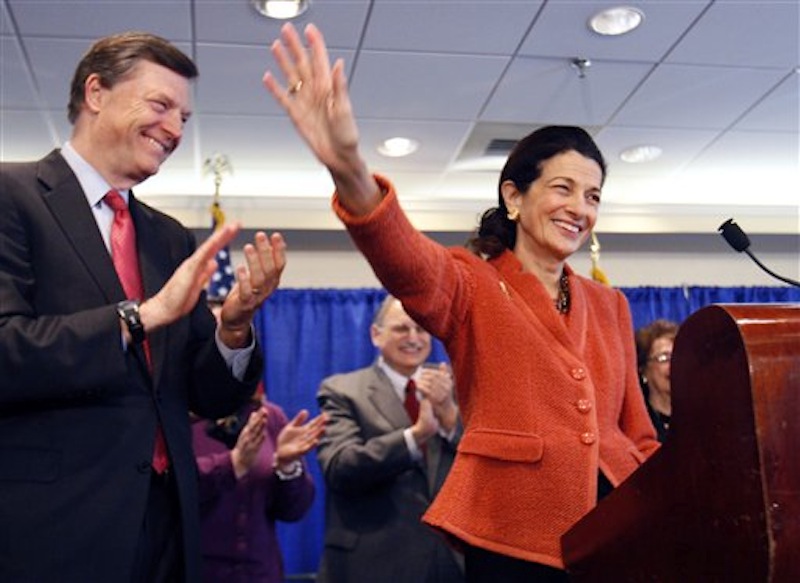 In this March 2, 2012 photo Republican Sen. Olympia Snowe, R-Maine, is applauded by her husband, Jock McKernan, left, and others as she waves goodbye at the end of a news conference in South Portland, Maine, where she announced she would not seek a fourth term. Republican Sen. Lisa Murkowski, R-Alaska, a moderate in an era of paralyzing partisanship, could be a natural heir to the centrist role played by Snowe at a time when their party is hurting for female leaders. (AP Photo/Robert F. Bukaty)
