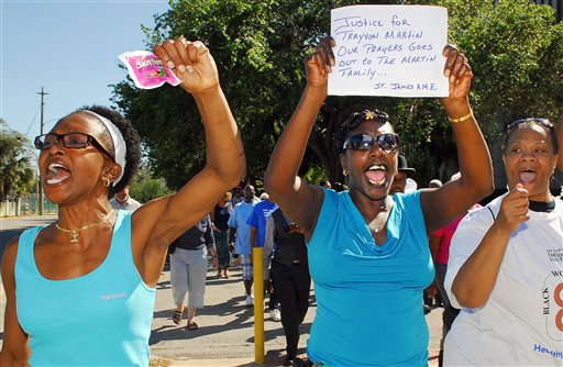 Phoebe Denson, left, Myrtle Hudson march towards the Titusville Courthouse on Sunday in Titusville, Fla. A rally was held demanding justice for Trayvon Martin, a black Florida teenager fatally shot by a white neighborhood watch volunteer. No charges have been filed in the February death.