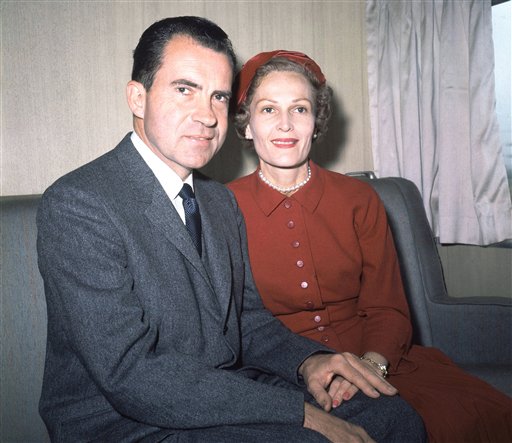 Former President Richard Nixon, left, and his wife Pat pose for photos while campaigning at Rockefeller Center in New York on June 5, 1960.
