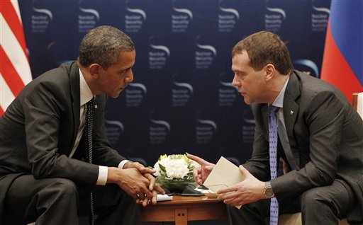 U.S. President Barack Obama, left, and Russian President Dmitry Medvedev chat during a bilateral meeting at the Nuclear Security Summit in Seoul, South Korea, today.
