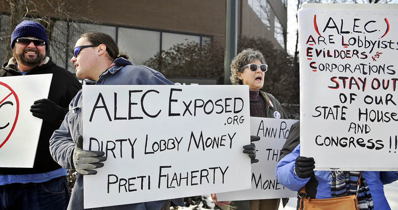 Members of Occupy Augusta picket Wednesday in front of the Augusta offices of the law and lobbying firm Preti Flaherty. Occupy wanted to raise attention about corporate influence on the political process during its noon time demonstration.