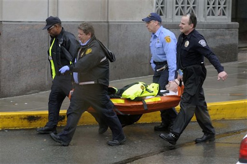 Police and paramedics carry a shooting victim from Western Psychiatric Institute and Clinic, Thursday, March 8, 2012 in Pittsburgh. A gunman opened fire at a psychiatric clinic at the University of Pittsburgh on Thursday in a shooting that killed two people, including the gunman, and wounded seven others. (AP Photo/Pittsburgh Tribune-Review, Justin Merriman)
