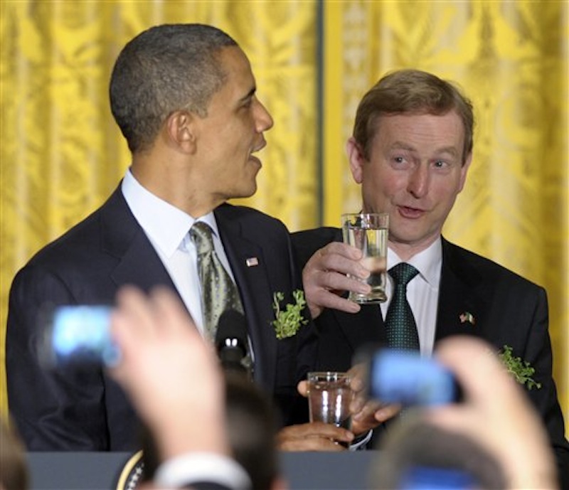 In this March 20, 2012, file photo President Barack Obama and Irish Prime Minister Enda Kenny prepare for a toast during a St. Patrick's Day reception in the East Room of the White House in Washington. During the reception Enda presented Obama with a certificate of Irish heritage. "This will have a special place of honor alongside my birth certificate," Obama deadpanned, drawing big laughs. (AP Photo/Susan Walsh)