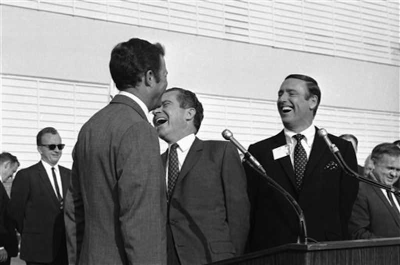 In this Oct. 10, 1968 photo, Republican presidential candidate Richard Nixon, center, laughs at something comedian Dick Martin, right, says, during a rally in Burbank, Calif., Oct. 10, 1968. Some decidedly unfunny candidates have benefited by exceeding extremely low expectations when it comes to jokes. When Nixon went on the TV comedy show "Rowan & Martin's Laugh-In" in 1968 and said "Sock it to ME?" he got rave reviews. (AP Photo/File) campaigns,celebrities,celebrity,elections,entertainment,Laugh-In,laughing,politicians,politics