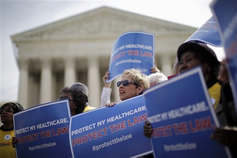 Supporters of health-care reform rally in front of the Supreme Court in Washington on Wednesday, March 28, 2012, on the final day of arguments regarding the health care law signed by President Barack Obama. (AP Photo/Charles Dharapak)