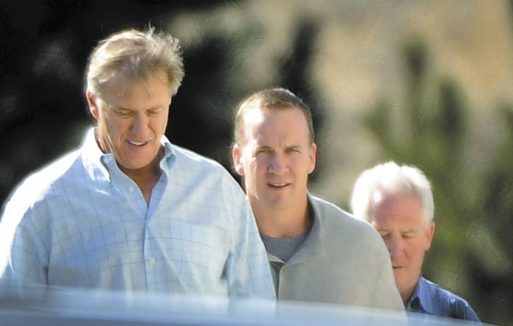 DRAWING INTEREST: Quarterback Peyton Manning, center, takes a tour with Denver Broncos executive vice president of football operations John Elway, left, and Broncos coach John Fox recently in Englewood, Colo.