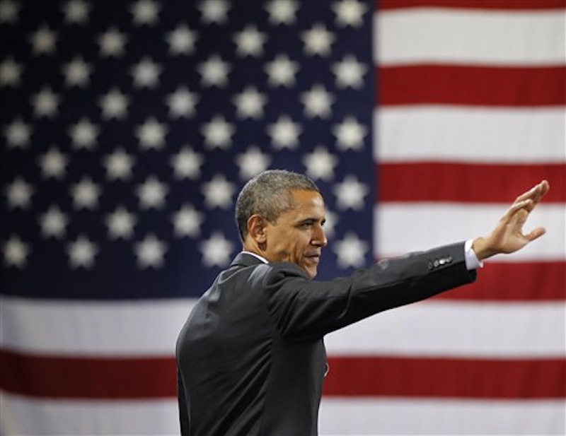 President Barack Obama waves to the crowd after speaking at a fundraiser at Southern Maine Community College, Friday, March, 30, 2012 in Portland, Maine. (AP Photo/Pablo Martinez Monsivais)
