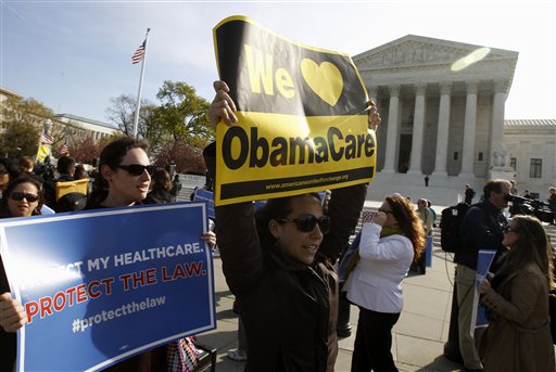 Supporters of health care reform rally in front of the Supreme Court in Washington today on the final day of arguments regarding the health care law signed by President Barack Obama.