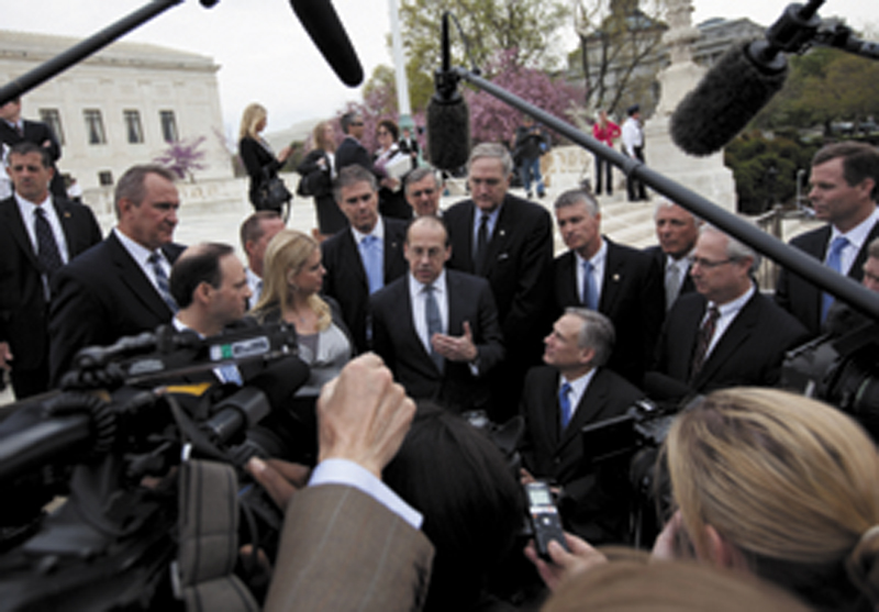 BIG CASE: Paul Clement, a lawyer for 26 states seeking to have the Patient Protection and Affordable Care Act tossed out, speaks to reporters Wednesday in front of the Supreme Court in Washington, at the end of arguments regarding the law.