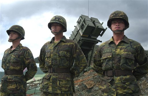 Taiwanese soldiers stand in front of a U.S.-made Patriot missile air defense system near the northern coastal town of Wanli, Taiwan, in this 2004 photo.