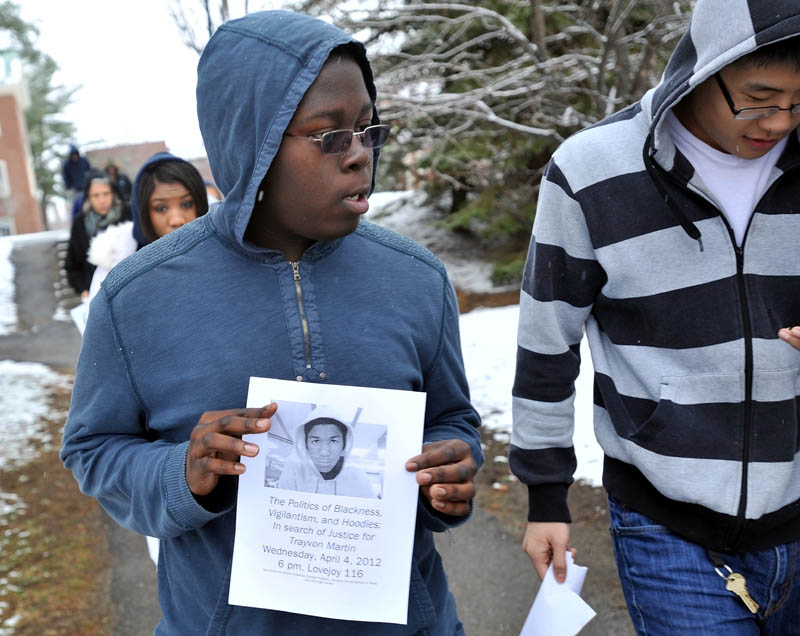 Photo by Michael G. Seamans Colby College sophomore, Omari Matthew, walks with other classmates near the Miller Library during a march to raise awareness of Florida teen, Trayvon Martin, who was fatally shot in February at Colby College Thursday afternoon.