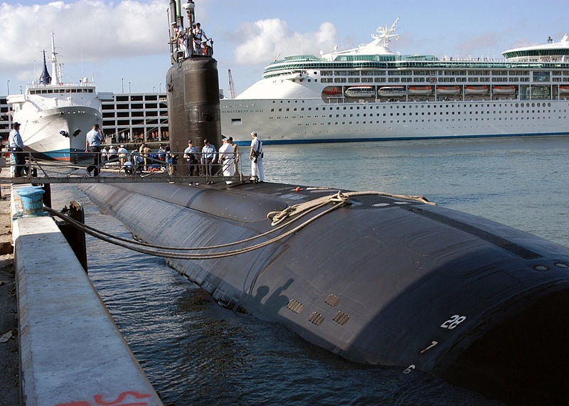 In this 2006 photo, The USS Miami, homeported in Groton, Conn., sits moored to a pier as sailors prepare to participate in Fleet Week in Port Everglades, Fla.