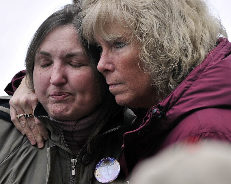 COMFORT: Phoebe DiPietro, grandmother of Ayla Reynolds, is comforted by her friend Connie McCord, of Waterville, at a vigil for the missing toddler at Castonguay Square in downtown Waterville on Saturday.