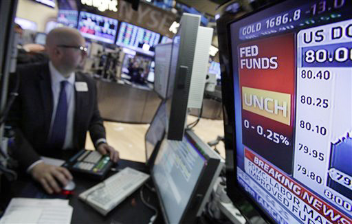 A display screen at a post on the trading floor of the New York Stock Exchange shows the rate decision by the Federal Reserve today.