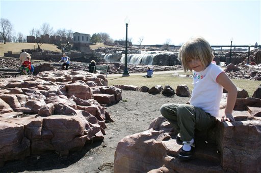 5-year-old Reagan Lovrien plays at Falls Park on Tuesday in Sioux Falls, S.D. Lovrien was at the park with her sister, 3-year-old Kinsey, and her grandmother, Sharon Lovrien of Sioux Falls.