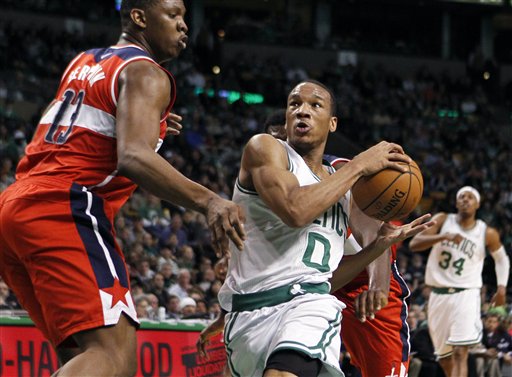 Boston Celtics' Avery Bradley (0) drives past Washington Wizards' Kevin Seraphin (13) in the second quarter of an NBA basketball game in Boston, Sunday, March 25, 2012. The Celtics won 88-76. (AP Photo/Michael Dwyer)