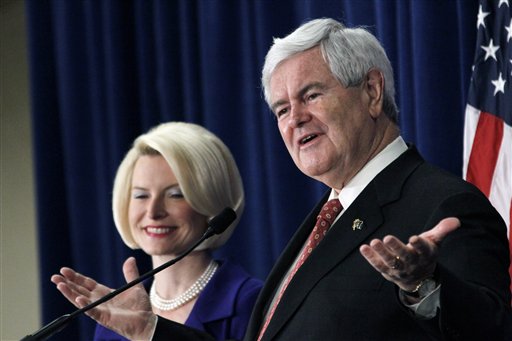 Republican presidential candidate Newt Gingrich, accompanied by his wife Callista, speaks at a rally in Jackson, Miss. on Thursday, March 8, 2012. (AP Photo/Rogelio V. Solis)