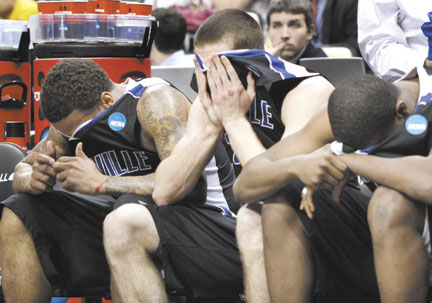 OH SO CLOSE: UNC-Asheville players, from left, J.P. Primm, Matt Dickey and Quinard Jackson cover their faces late during a 72-65 loss against Syracuse in the second round of the NCAA tournament East Regional on Thursday in Pittsburgh. The Syracuse win made it 109-0 for No. 1 seeds against No. 16s since the NCAA went to a field of 64 in 1985.
