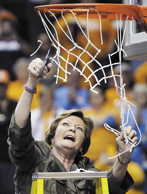 TIME TO CELEBRATE: Tennessee head coach Pat Summitt cuts down the net after the Lady Vols defeated LSU 70-58 to win the Southeastern Conference title last weekend in Nashville, Tenn.