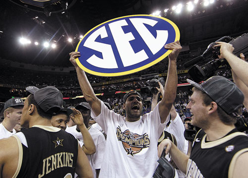 WE DID IT: Vanderbilt forward Jeffery Taylor holds up an SEC sign after Vanderbilt beat Kentucky 71-64 to win the Southeastern Conference tournament last weekend at the New Orleans Arena in New Orleans.