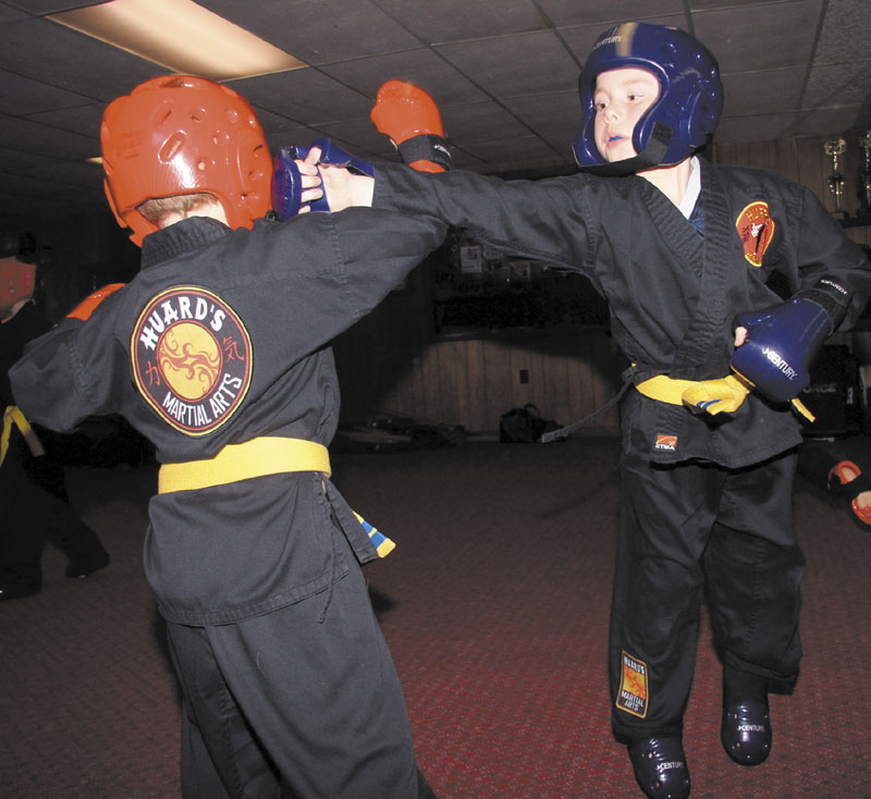 GETTING READY: Brothers Christopher and Ethan Loubier of Winslow practicing for the Battle of Maine recently at Huard’s Martial Arts Dojo in Winslow.
