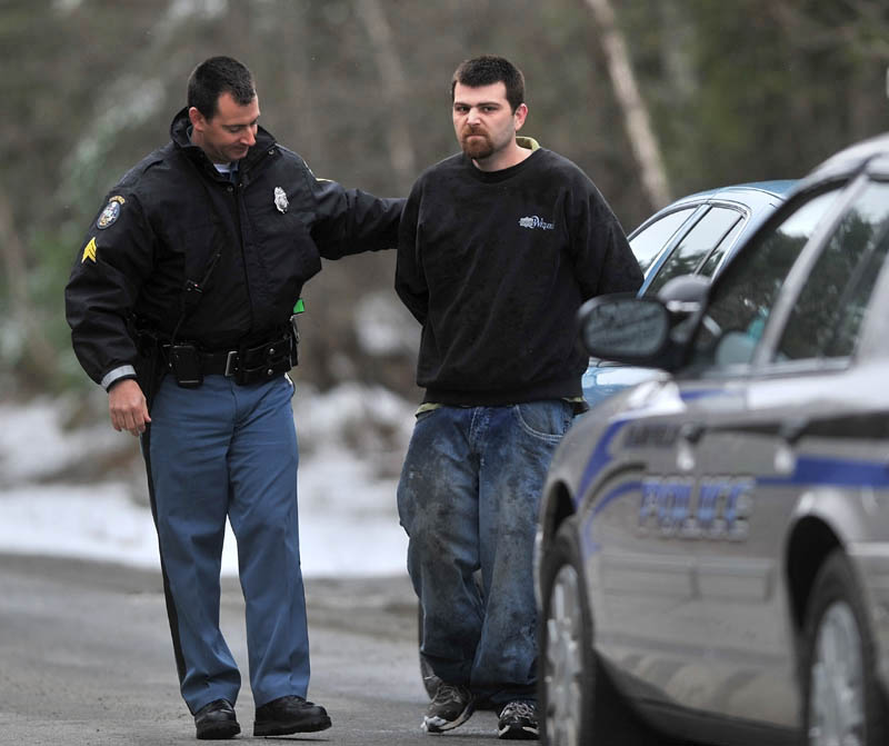 Sgt. Peter Michaud with the Maine State Police arrests Joshua Elliott, 30, of Fairfield for eluding police and driving while under suspension on Wood Lane in Fairfield Center who was involved in a car chase that included Oakland, Fairfield and Waterville Friday afternoon.