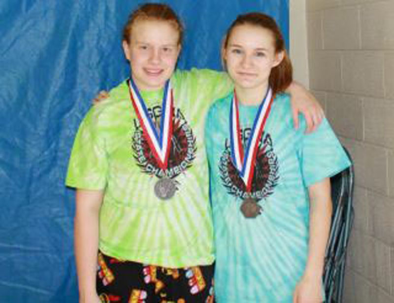 BUILDING ON SUCCESS: Monmouth High School’s Tammy Cushman, left, and Monmouth eighth-grader Emily Levasseur both placed second in the girls New England Open in Nashua, N.H, and will now compete in the 15th annual National Girls Wrestling championships March 31 and April 1 at Eastern Michigan University in Ypsilanti, Mich.