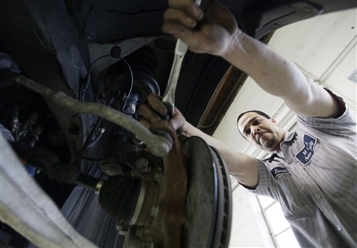 In this March 2, 2012 photo, Javier Soto works on a brake assembly at M&A Auto Body shop in Chicago. U.S. companies added 227,000 jobs in February, completing the three best months of hiring since the Great Recession began. (AP Photo/Nam Y. Huh)