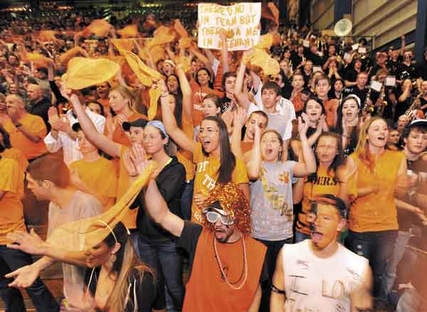 ORANGE CRUSH: Gardiner Area High School fans cheer on the Tigers during the Class B state championship game against Yarmouth on Friday night at the Bangor Auditorium. Gardiner lost 65-53.