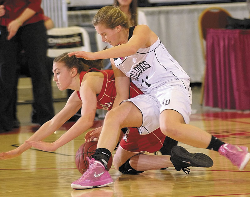 Central junior guard Emylee Miles, left, and Hall-Dale freshman guard Nicole Pelletier slide to the ground as they're about to wrestle for a loose ball during the Class C state championship game on Saturday night at the Augusta Civic Center.