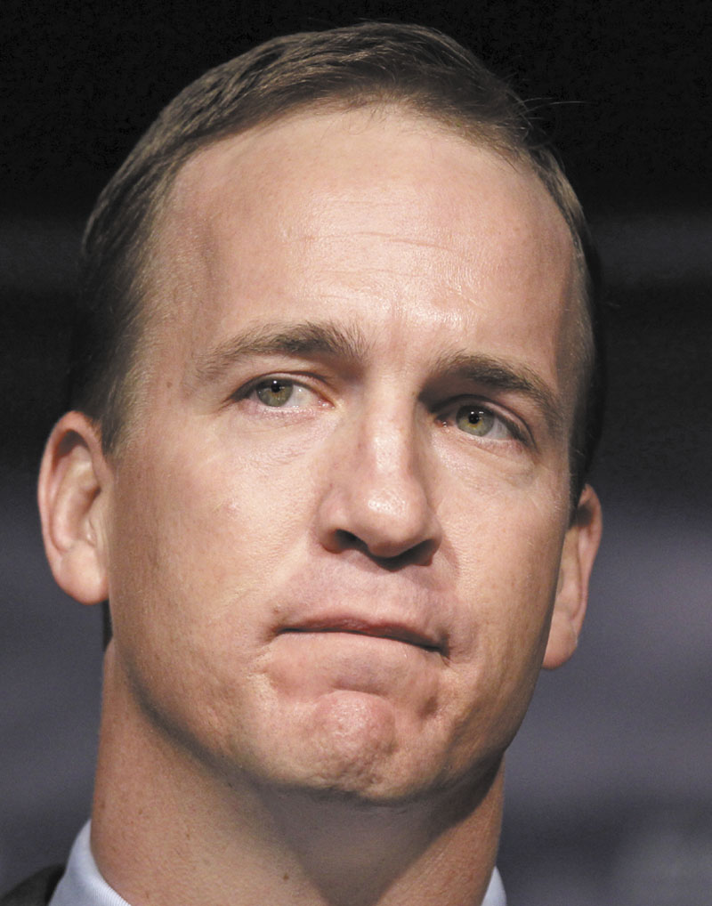 Quarterback Peyton Manning grimaces during a news conference in Indianapolis, Wednesday, March 3, 2012. Manning's record-breaking run as quarterback of the Colts ended Wednesday, when team owner Jim Irsay announced the team would release its best player. (AP Photo/Michael Conroy)