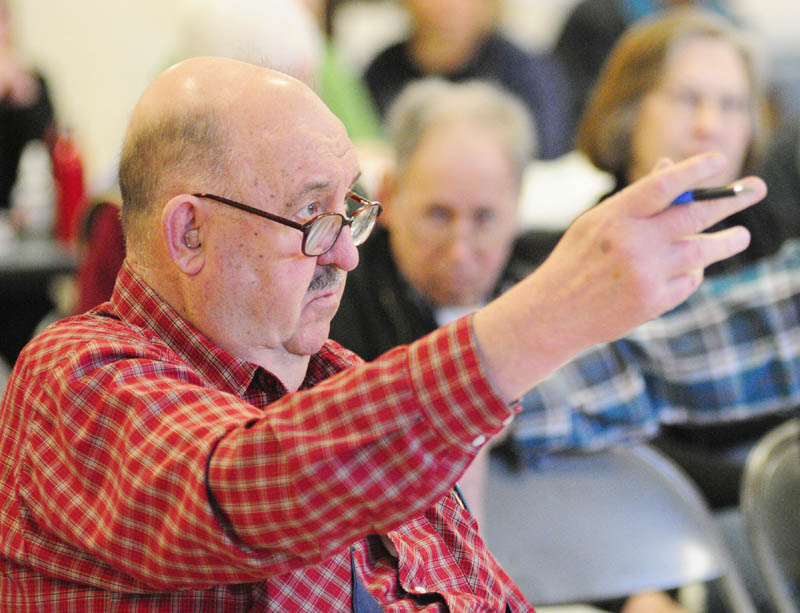 Resident Bob Bender asks a question during the annual town meeting on Saturday morning at the Pittston School.