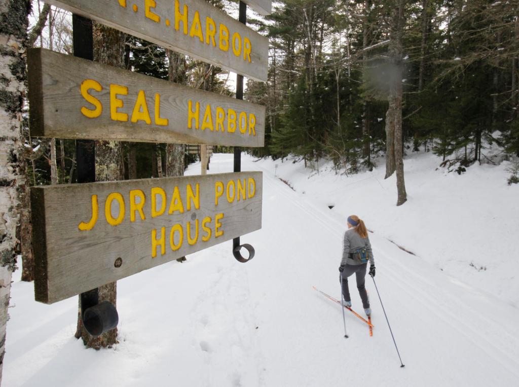 In this January 2010 photo, Abigail Curliss of Southwest Harbor skis alongside Eagle Lake on a carriage road in Acadia National Park. In a sign that spring is on the way, the park closed the carriage roads this week.