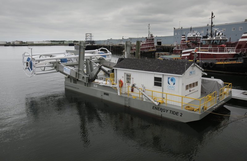 A prototype of Ocean Renewable Power Co.’s tidal power turbine was on display over the summer in Portland. It is seen here at the rear of the vessel Energy Tide 2. The prototype measured 46 feet, while the turbines being built for installation will be 90 feet long.