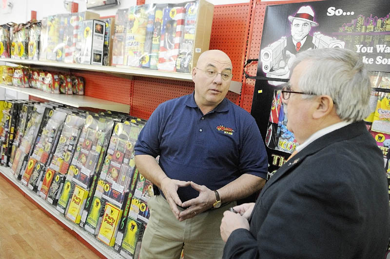 WELCOME TO PYRO CITY: On the opening day of his new store Pyro City, Steve Marson, left, chats on Thursday in Manchester with state Rep. Doug Damon, R-Bangor, who sponsored the bill last year that legalized fireworks sales in Maine.