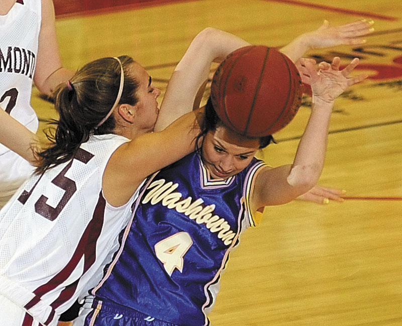 Richmond's Jamie Plummer, left, and Washburn's Rayah Saucier tangle up over a rebound during the Class D state championship game on Saturday afternoon at the Augusta Civic Center.