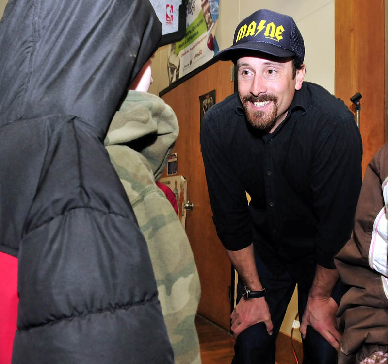 COOL: Olympic gold medalist Seth Wescott answers questions from Bloomfield Academy student Seth Campbell following a slideshow on winter activity to students at the Skowhegan school on Thursday.